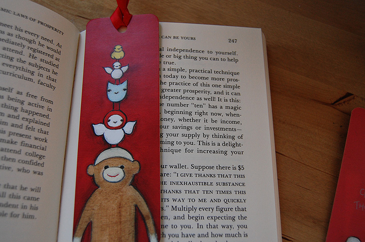 Sock monkey on book