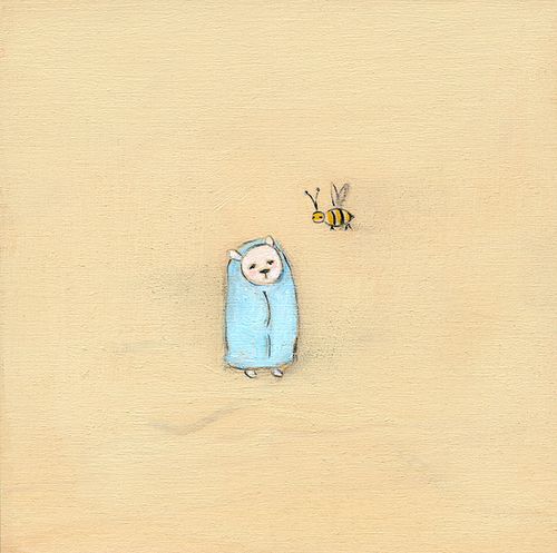 A bear in a blue blanket