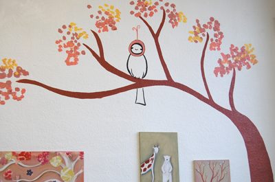 the paintings are hung in the gallery with care